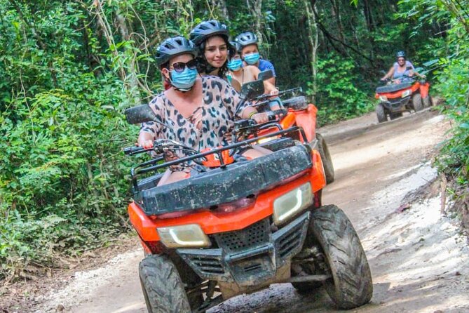Adrenaline Tour with ATV, Ziplines and Cenote from Cancun - Riding the ATVs on the jungle track