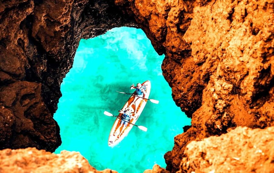 Albufeira: Hidden Beaches & Cliffs Guided Kayak Cave Tour - The first paddle past Praia da Coelha