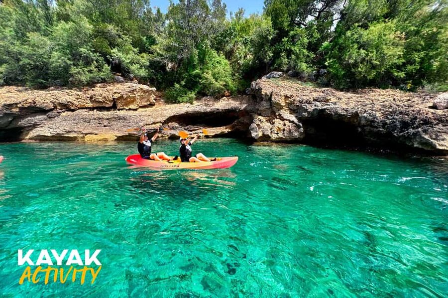 Alcudia: Kayak Tour with Snorkel & Sea Cave Swim - Entering the sea caves