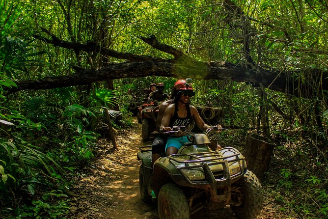 Amazing ATV Tour, Ziplines and Cenote Swim with Lunch and round trip included - Zip lines over the trees
