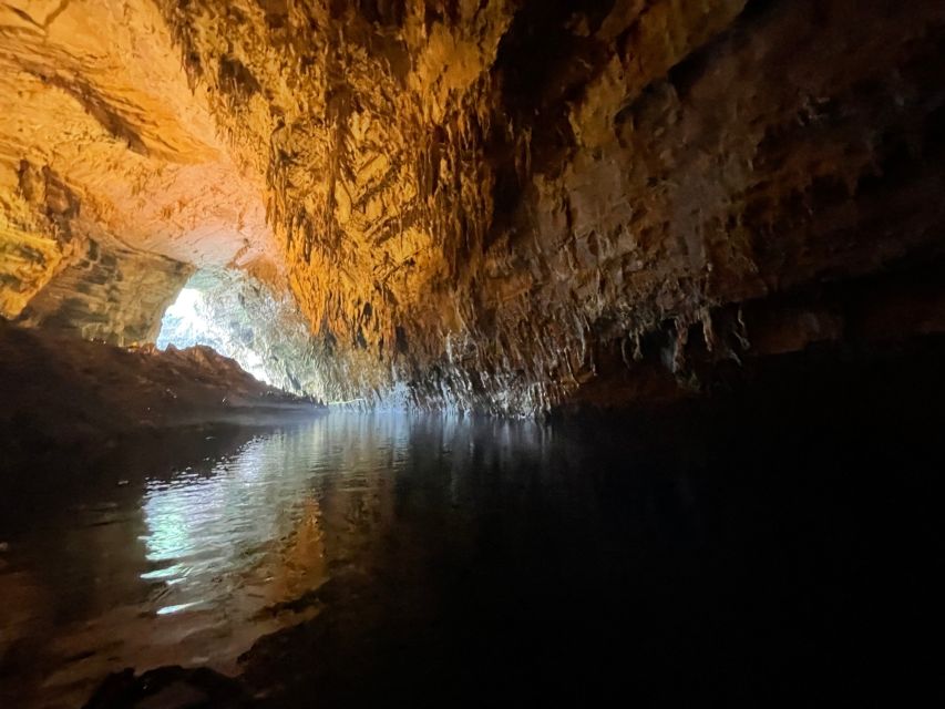 Argostoli: Melissani Lake, Drogarati Cave, and Myrtos Beach - Melissani Lake’s short underground boat ride