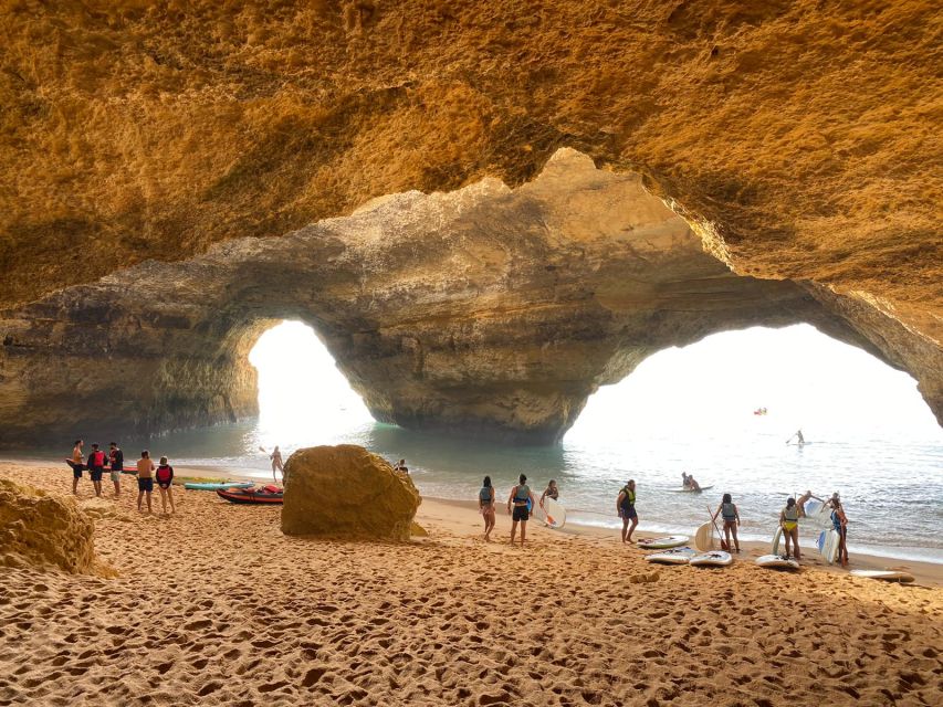 Benagil: Sunrise kayak tour Benagil caves and secret spots - Entering Benagil Cave and reaching its beach
