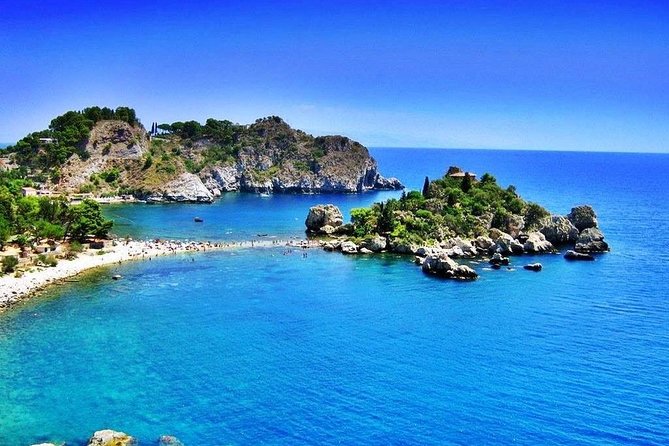 Boat tour Giardini Naxos Taormina Isola Bella Blue Grotto - Leaving Giardini Naxos on a compact, shaded boat
