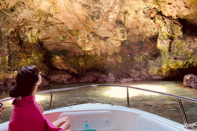 Boat tour of the Polignano a Mare caves with aperitif - Cala Paura and the Torno Subito sign