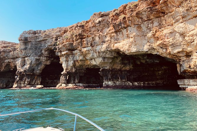 Boat tour of the Polignano a Mare caves with aperitif - Grotta Azzurra and the play of light