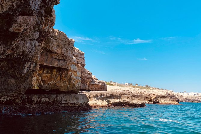 Boat tour of the Polignano a Mare caves with aperitif - Grotta Palazzese and its famous restaurant