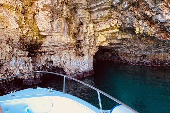 Boat tour of the Polignano a Mare caves with aperitif - Scoglio dell’Eremita and its iron cross