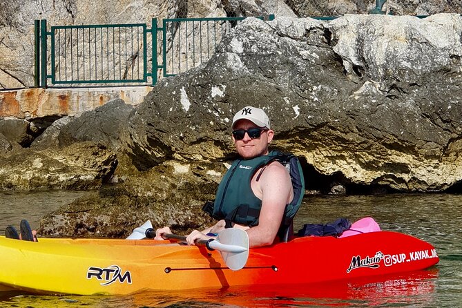 Budva Bay: Kayak & SUP Tour to Coastal Caves - Entering Pigeon Cave by kayak