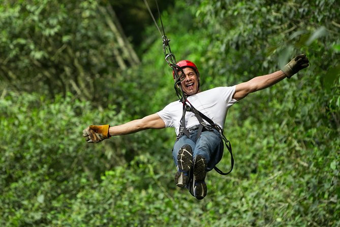 Cancun Combo Tour: ATV and Zip- lines with Cenote Swim - ATV riding on a dusty, rocky track