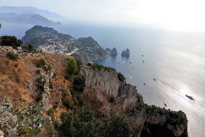 Capri & Blue Grotto: Full-Day Tour with Guided Island Exploration - Capri town, boutiques, and the famous gardens