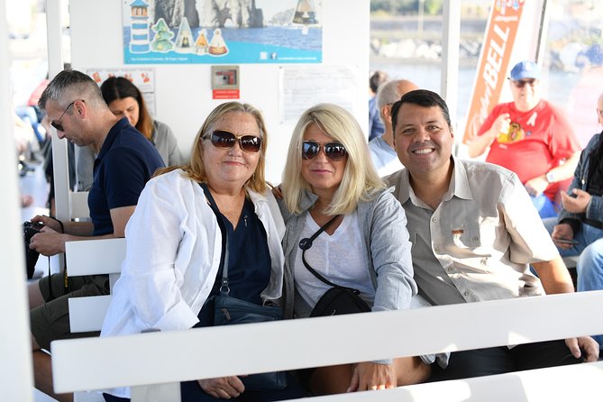 Capri Coast to Coast: Boat Tour with Optional Blue Grotto - Guides, commentary, and the best place to sit