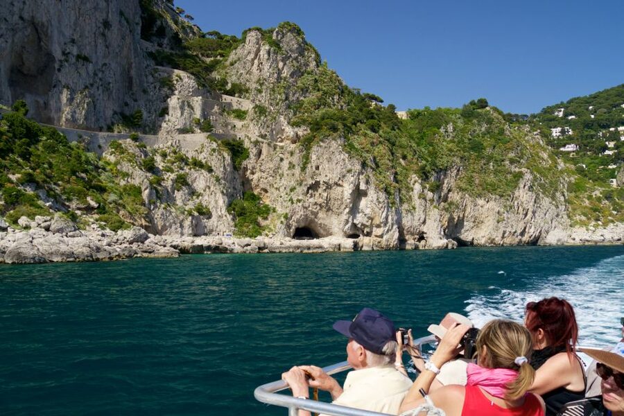 Capri: Guided Island Boat Tour With a Stop at the Caves - The Scugnizzo statue and Capri’s eastern coast