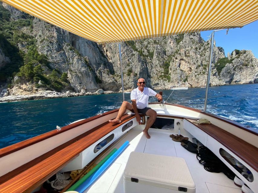 Capri: Island and Grottos Boat Cruise with Snacks and Drinks - Entering the White and Green Grottos