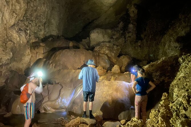 Cole's Cave Spelunking Adventure - Swimming beneath the waterfalls