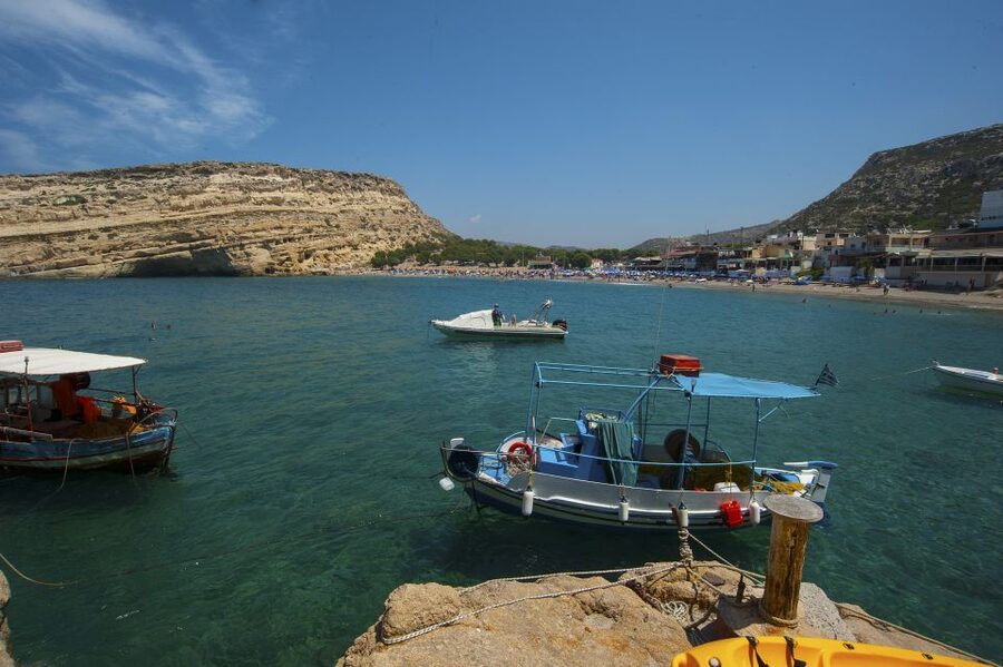 Crete: Matala Beach and Hippie caves, Red beach - Matala village, murals, shops, and lunch