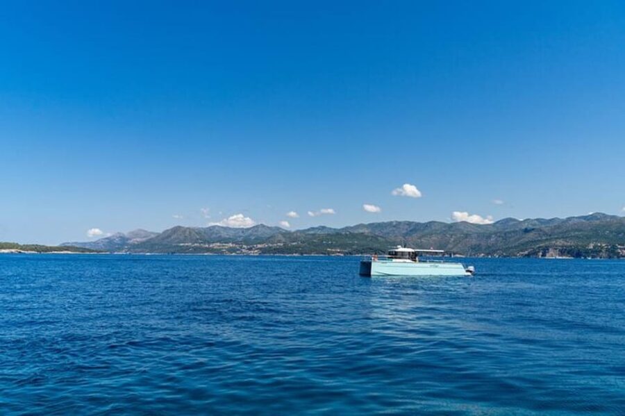 Dubrovnik: Blue Cave Catamaran Tour with Drinks and Snorkel - The Blue Cave’s brief natural light show