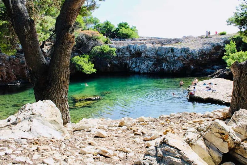 Dubrovnik: Lokrum Island and Betina Cave Boat Tour - Leaving Dubrovnik with the city walls in view