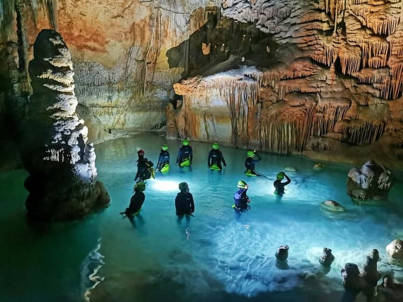 Estany d'en Mas: Coastal Hike, Abseil & Sea Cave Exploration - Inside the cave: lakes, columns, and narrow passages