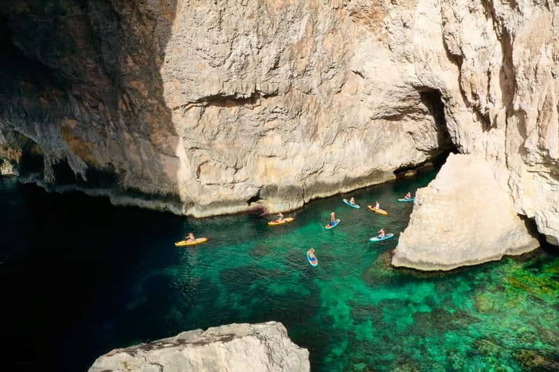 Explore Malta’s Blue Grotto by SUP - Paddling through Blue Grotto Bay