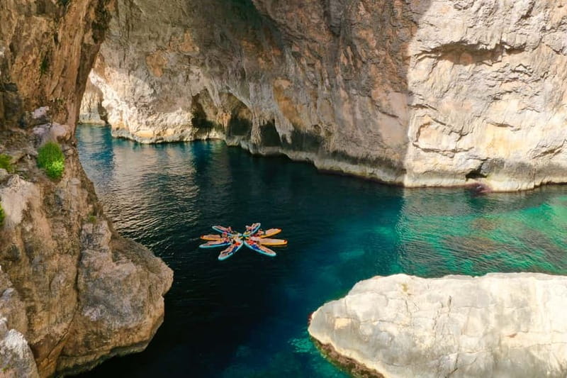 Explore Malta’s Blue Grotto by SUP - The clear-water swim stop