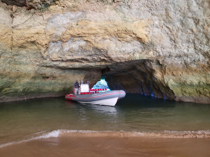 From Albufeira: Benagil Caves and Dolphins Guided Boat Tour - Entering the caves by speedboat