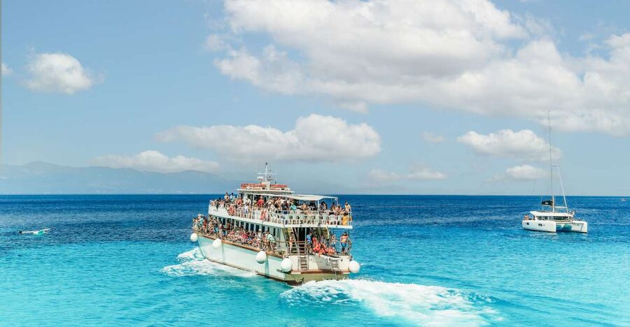 From Corfu Island: Antipaxos & Paxos Blue Caves Boat Cruise - The Blue Caves and the white cliffs of Erimitis