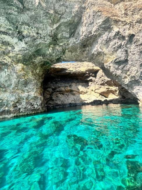 From Gozo:Around Comino, Blue Lagoon, Crystal Lagoon & Caves - Comino from the water: caves, bays, and landmarks