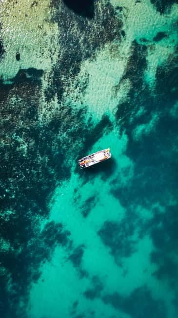 From Lagos: Ponta da Piedade Caves Kayak Tour from Catamaran - The Catamaran Ride to the Cliffs