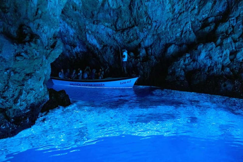 From Milna, Supetar, Postira: Magical Blue Cave and Hvar - Entering Biševo’s Blue Cave by paddle boat
