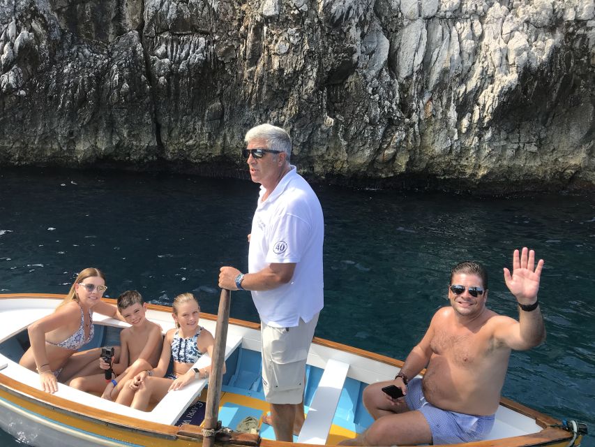 From Naples: Blue Grotto and Capri Trip - Entering the Blue Grotto by Rowboat