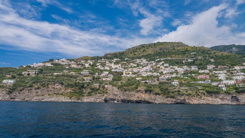 From Positano: Amalfi Coast and Emerald Grotto Group Cruise - Positano from the water, then the first caves