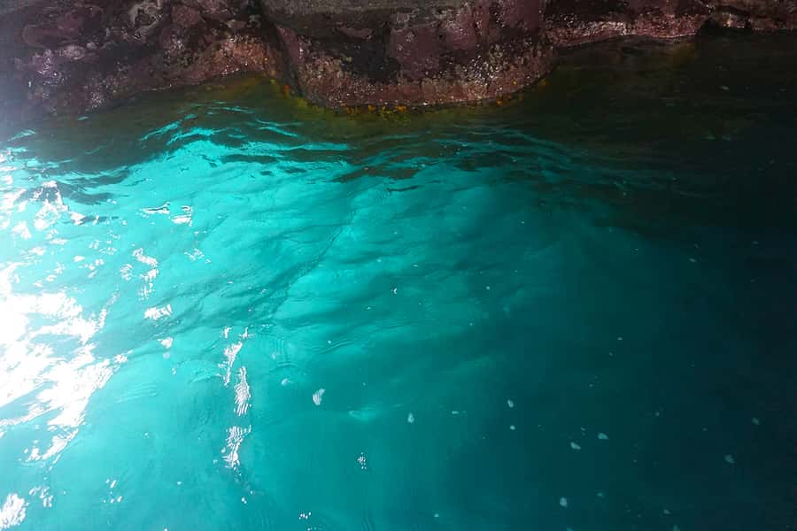 From Praia: Boat Trip, Snorkeling, Cave & BBQ on the Beach - A black-sand beach lunch with few comforts