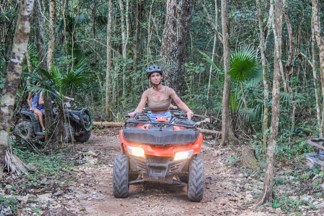 Half Day in Cancun Atvs Ziplines and Cenote Park - Zip lines and hanging bridges above the trees