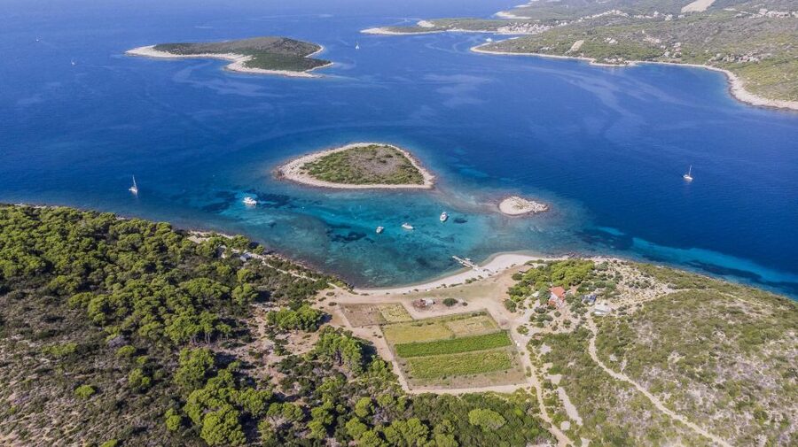 Hvar: Blue Cave, Green Cave & Stiniva Beach Speed Boat Tour - Stiniva Cove, cliffs, and a narrow entrance