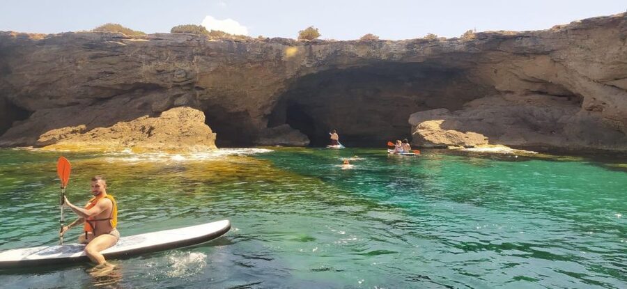 Ibiza: Sea Caves & Coves Snorkeling Paddle Boarding Tour - Drinks, fruit, and the onboard atmosphere