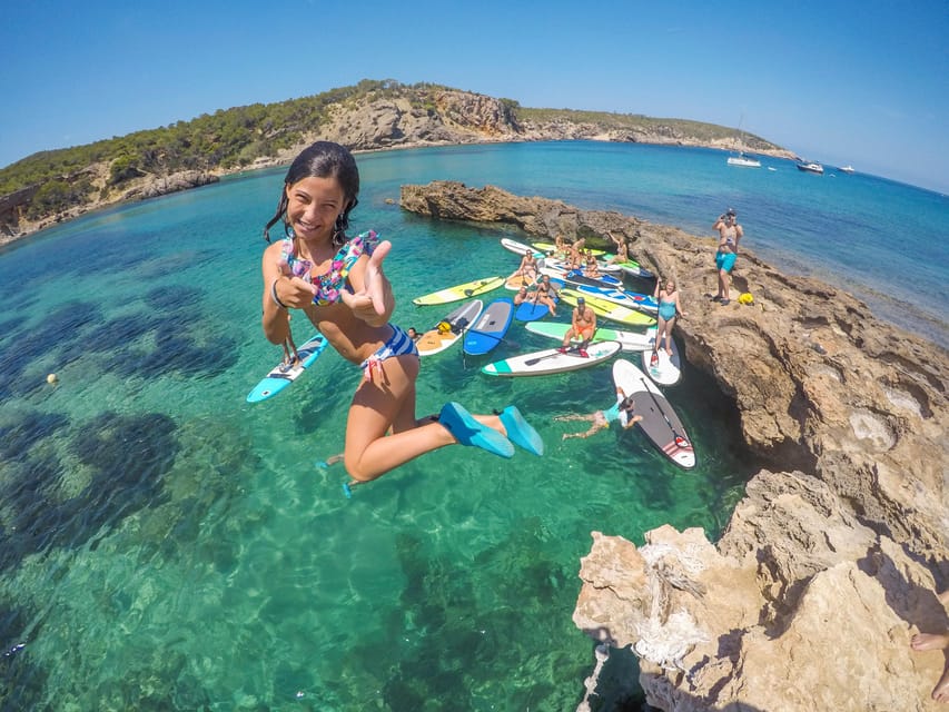Ibiza: Stand-Up Paddle Boarding Trip to Secret Caves - Getting steady on the board before the caves