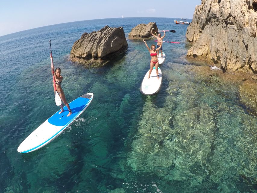 Ibiza: SUP & Snorkel Boat Tour with Caves, Drinks & Photos - Paddling through coves and sea caves