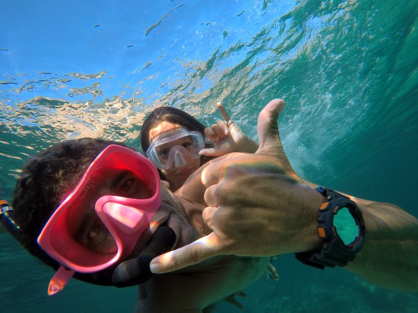 Ibiza: SUP & Snorkel Boat Tour with Caves, Drinks & Photos - Photos from the boat, boards, and underwater