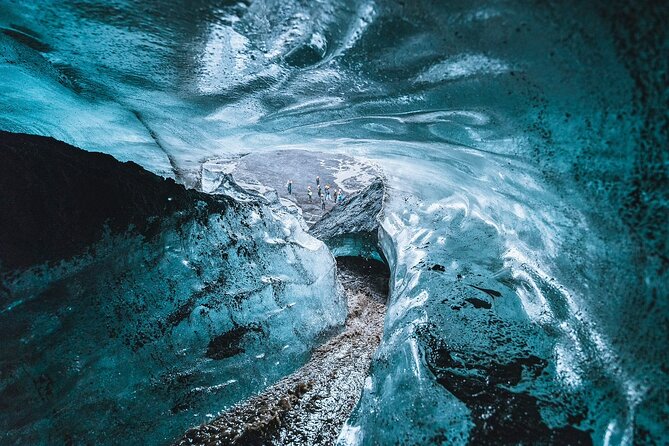 Ice Cave Tour from Vík - Walking across black volcanic ground