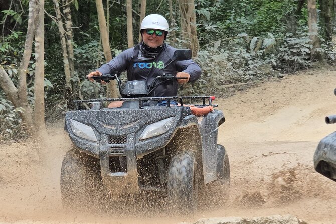 Jade Caverns and Mayan Village Cozumel ATV TOUR - Riding the ATV through dirt, rock, and mud
