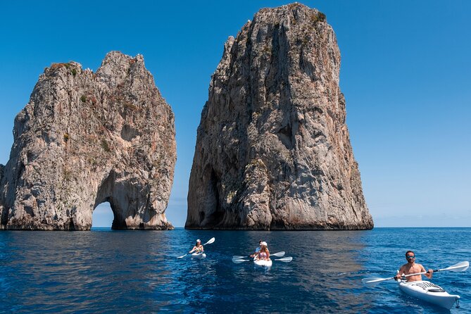 Kayak tour in Capri between caves and beaches. Photos included. - Swimming near a quieter beach
