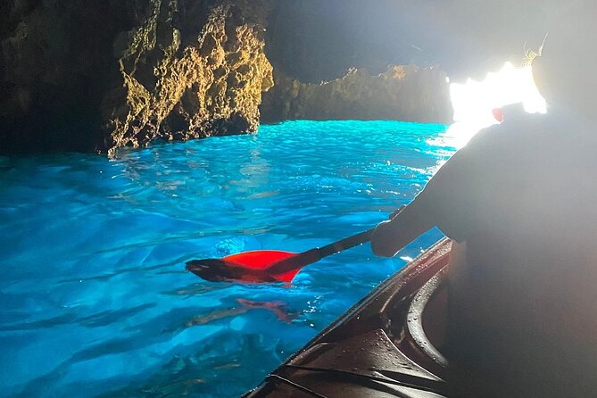 Kayak Trip to Hidden blue Cave, with lunch & fruits. - Swimming and snorkeling at remote beaches