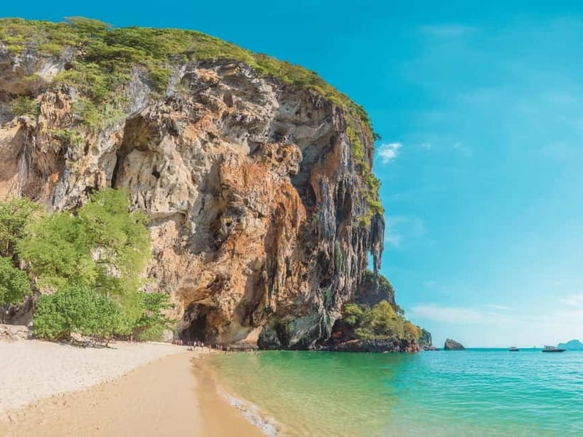 Krabi: Railay Phra Nang & Diamond Cave Sunset Plankton Tour - Phra Nang Beach, cave legends, and climbers