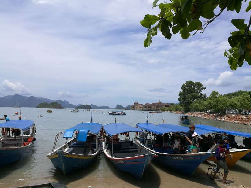 Langkawi: Mangrove Kilim UNESCO Geopark & Cave Tour - The floating fish farm in a sheltered cove