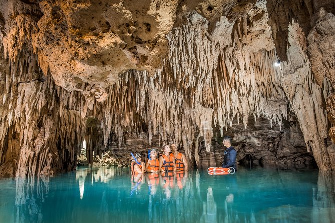 Magical Cenote and Paradise Lagoon Snorkeling Adventure - Entering the cool, dark cenote