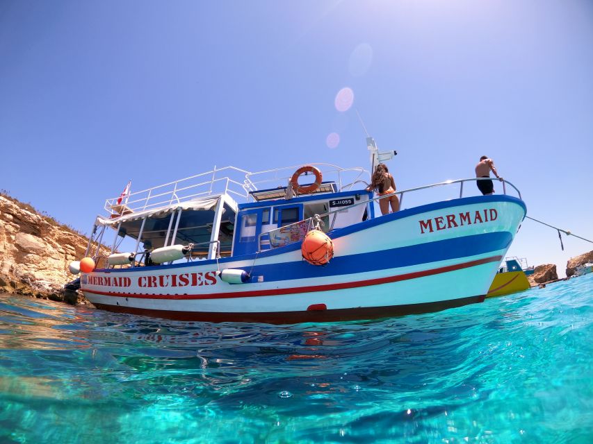 Malta: Comino Blue Lagoon Boat Tour, Sea Caves & Swim Stops - What the first hour from Bugibba feels like
