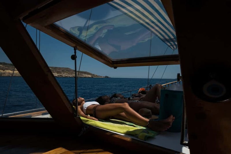Malta: Comino, Santa Maria Bay, Blue Lagoon & Sea Caves Tour - Food, drinks, music, and the onboard mood