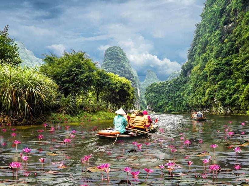 Ninh Binh Cycling Tour: Tam Coc Boat, Mua Cave & Rural Life - Riding through villages, rice fields, and karst peaks