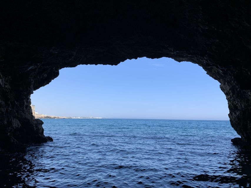 Polignano a Mare: Cave Boat Tour with Aperitif - Grotta Palazzese and the cliffs below town
