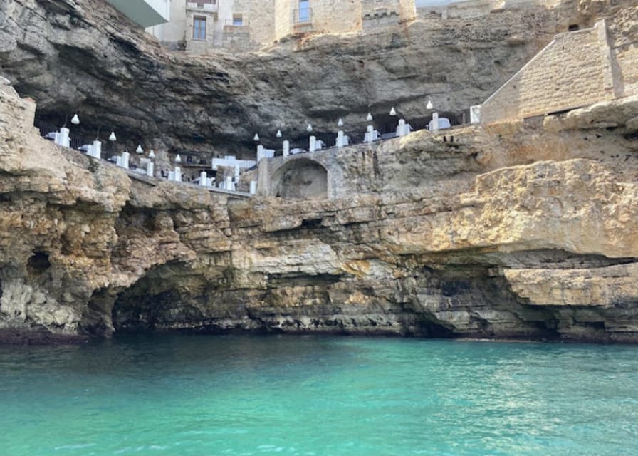 Polignano's coast and caves: a boat tour with drinks, swimming, music, and fun - Seeing Polignano a Mare from the water